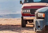 front end of new land cruiser with fj60 in the background