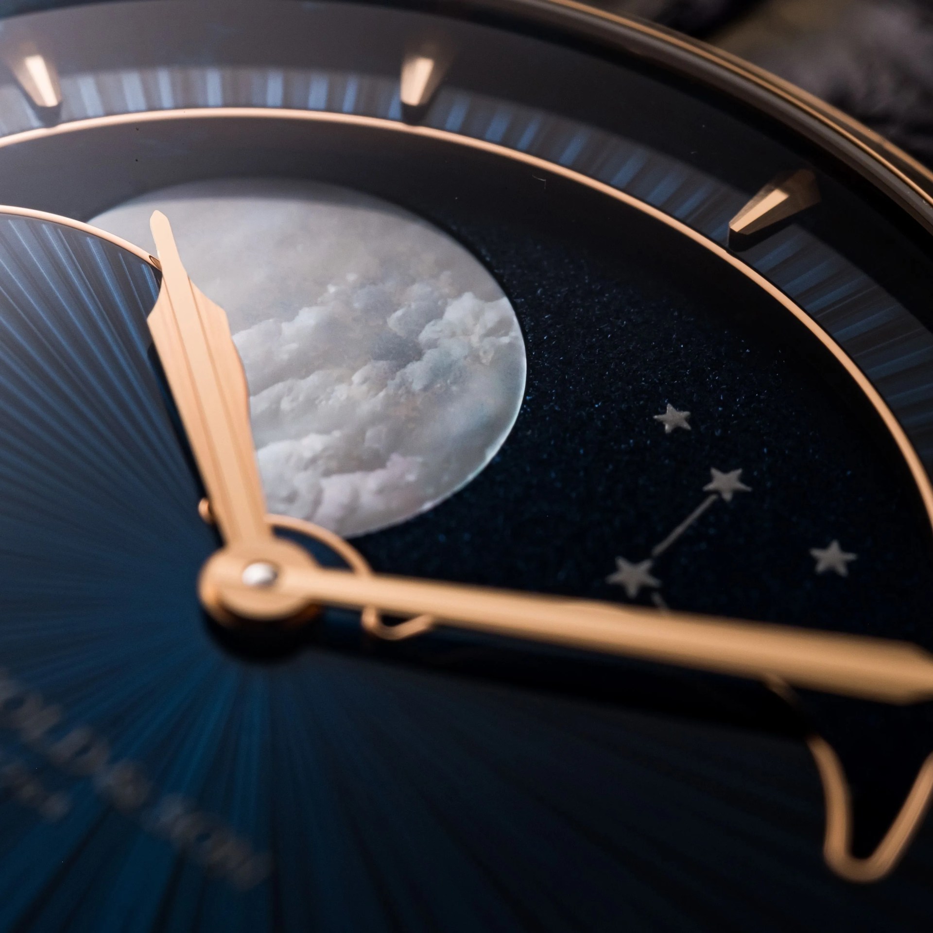 closeup of a moon phase watch dial