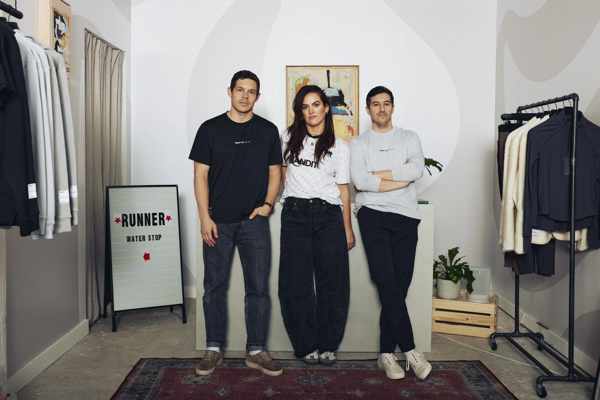 the 3 founders of bandit running standing in the store front