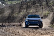subaru solterra driving on a dirt road