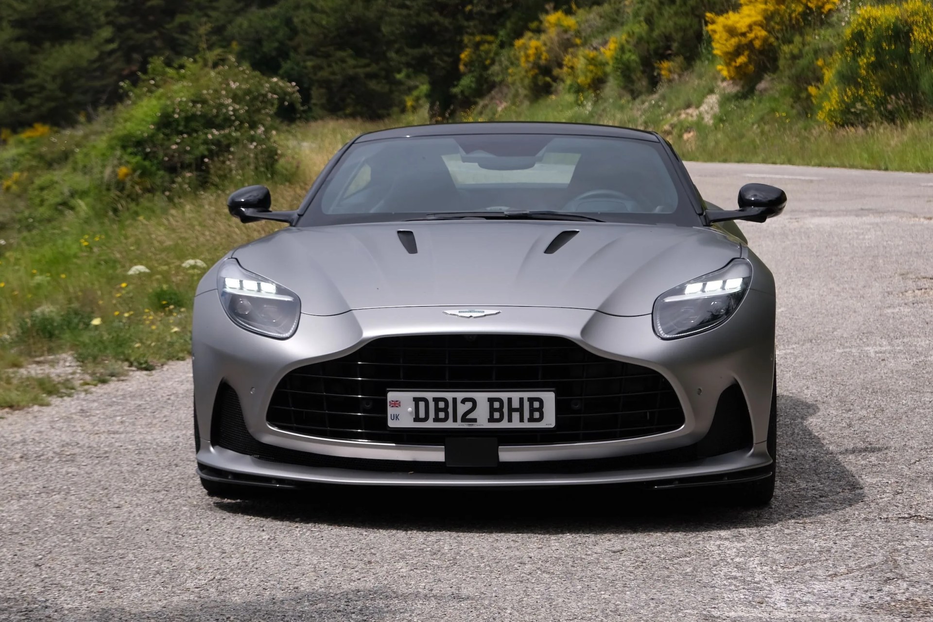 aston martin db12 parked by a french roadside