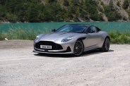 aston martin db12 parked next to lake