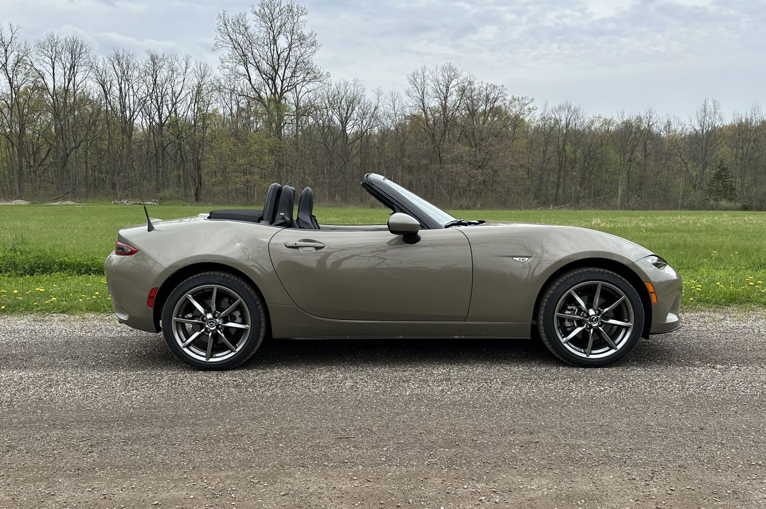 mazda mx5 parked on a dirt road