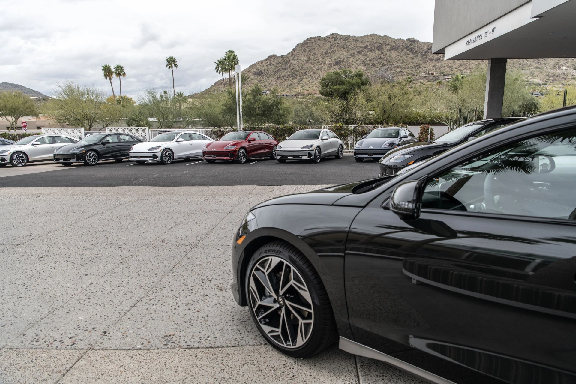 parking lot filled with hyundai ioniq 6s with one in foreground