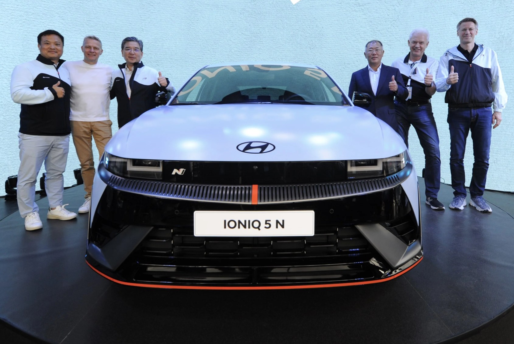 ioniq 5 n with older guys giving thumbs up in the background