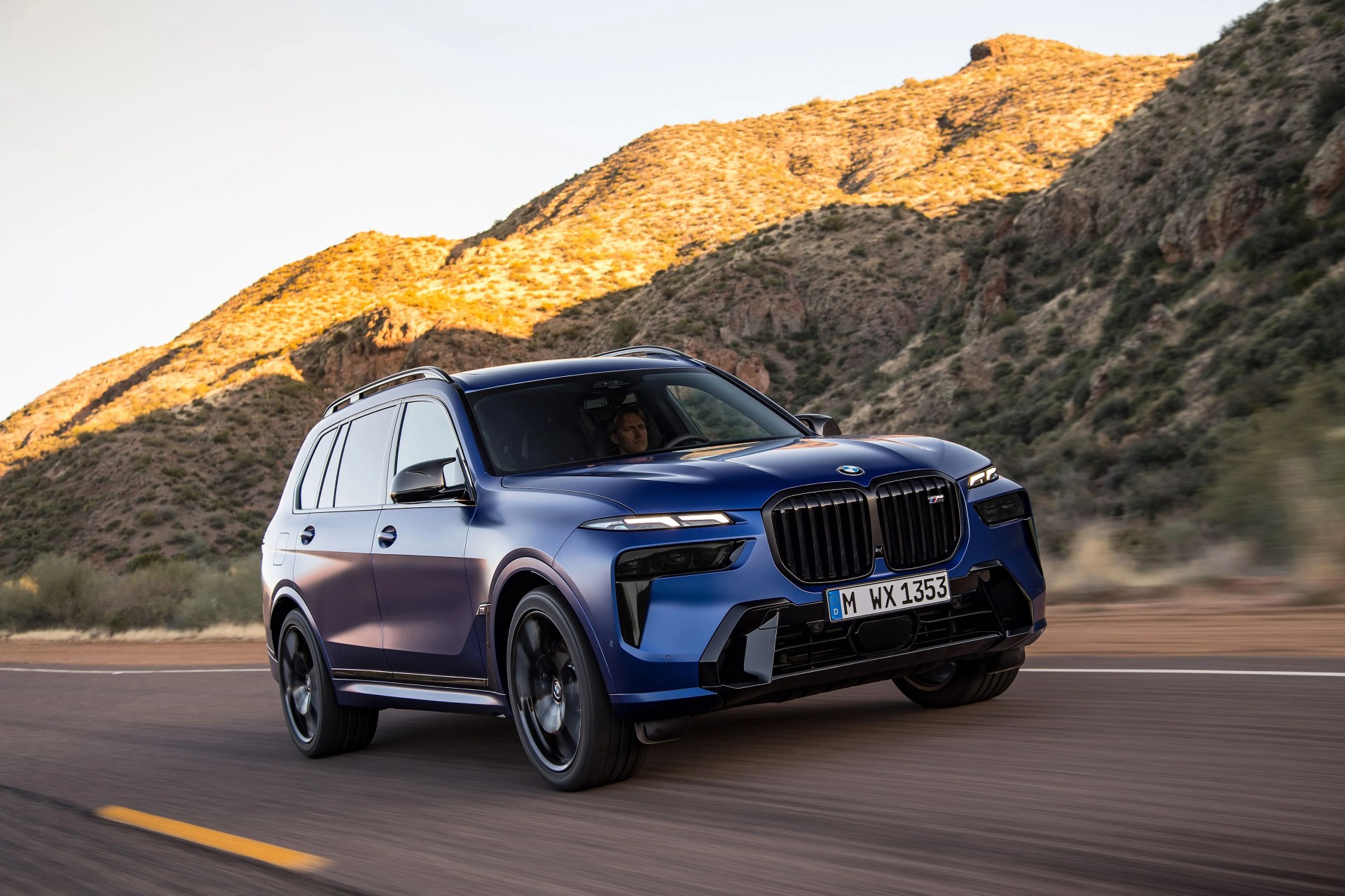 bmw x7 driving on road