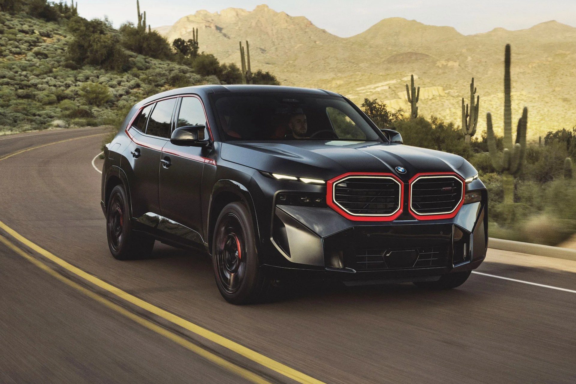 bmw xm label red driving in the desert