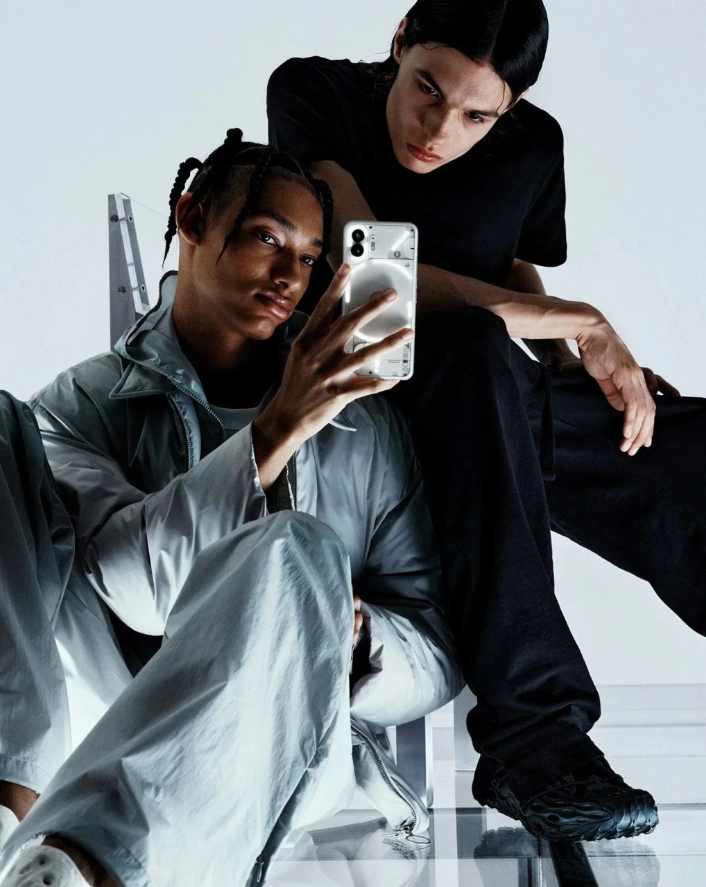 man and woman using nothing phone