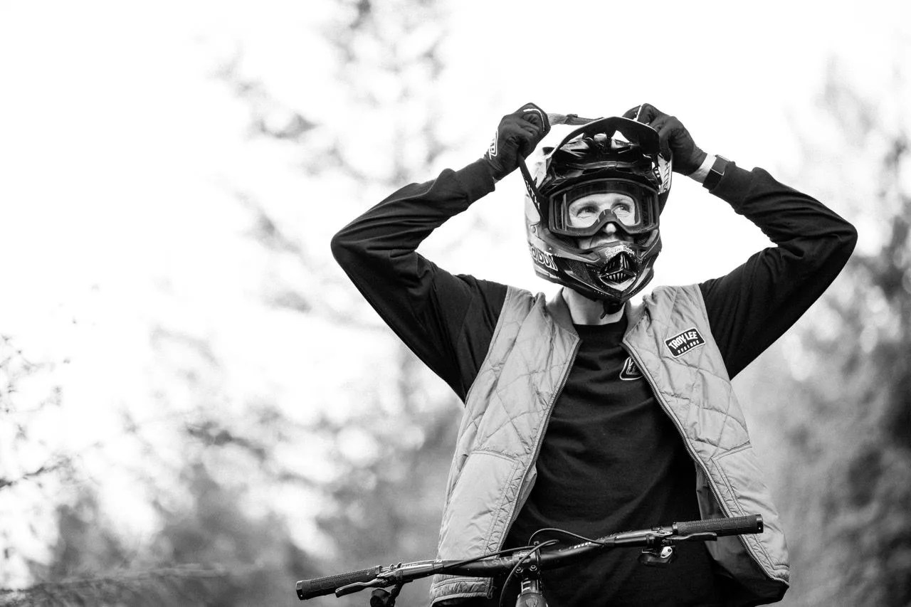 mountain biker putting on glasses in black and white