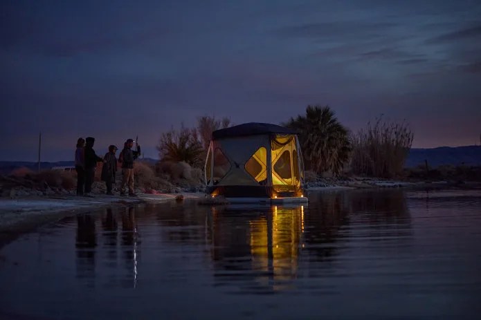 space acacia tent floating on a lake