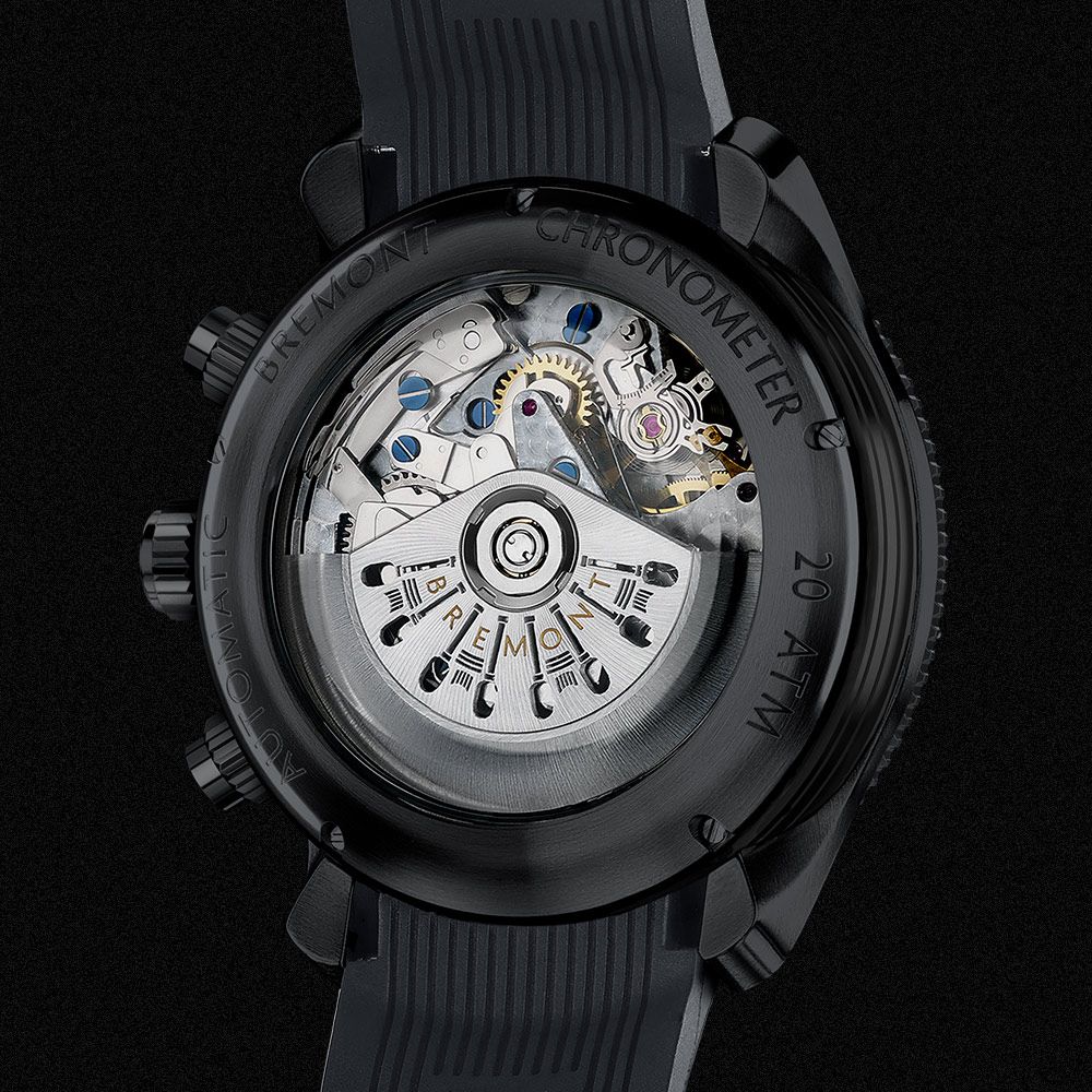 reverse of watch on black background