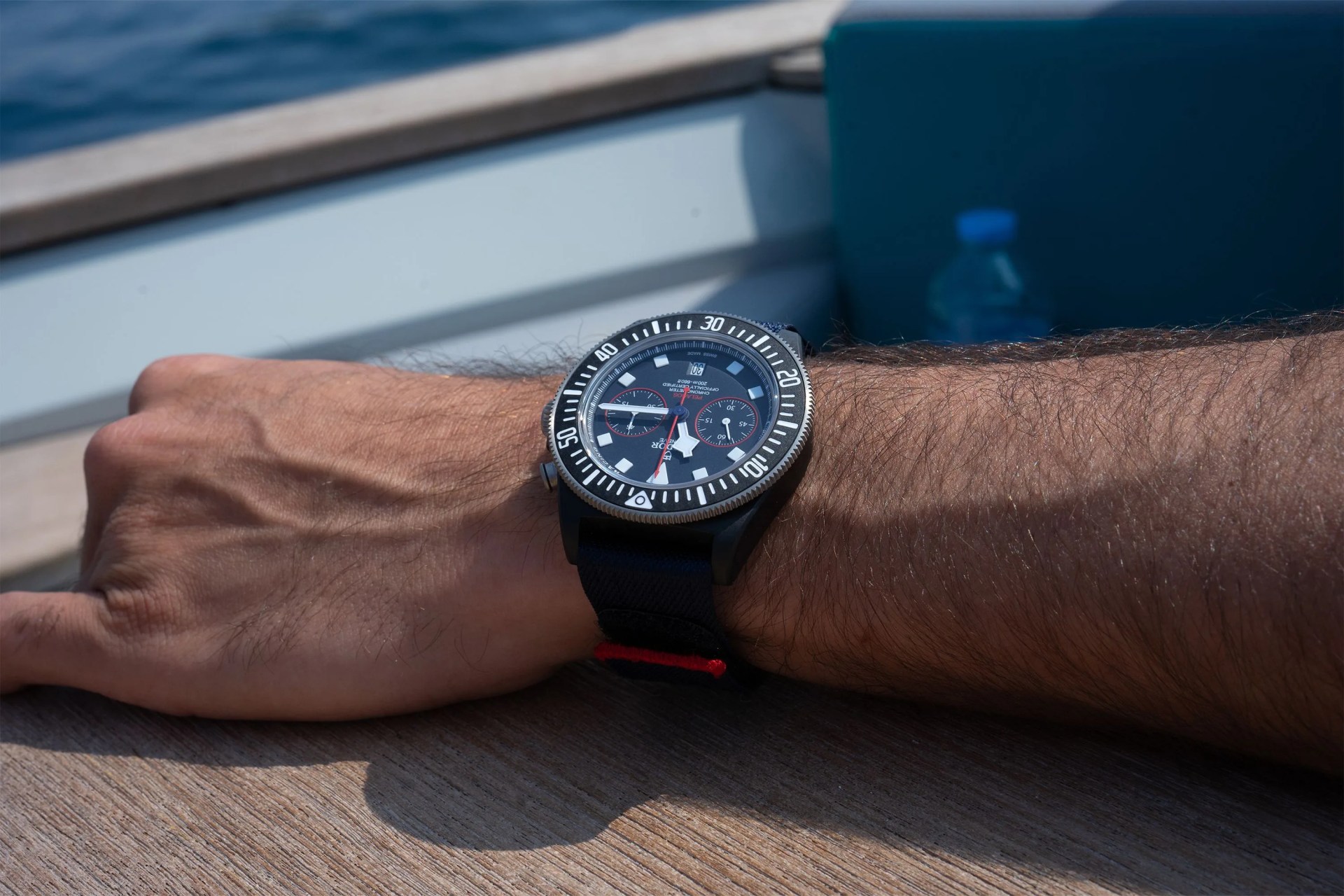 a man wearing a watch while on a sailboat