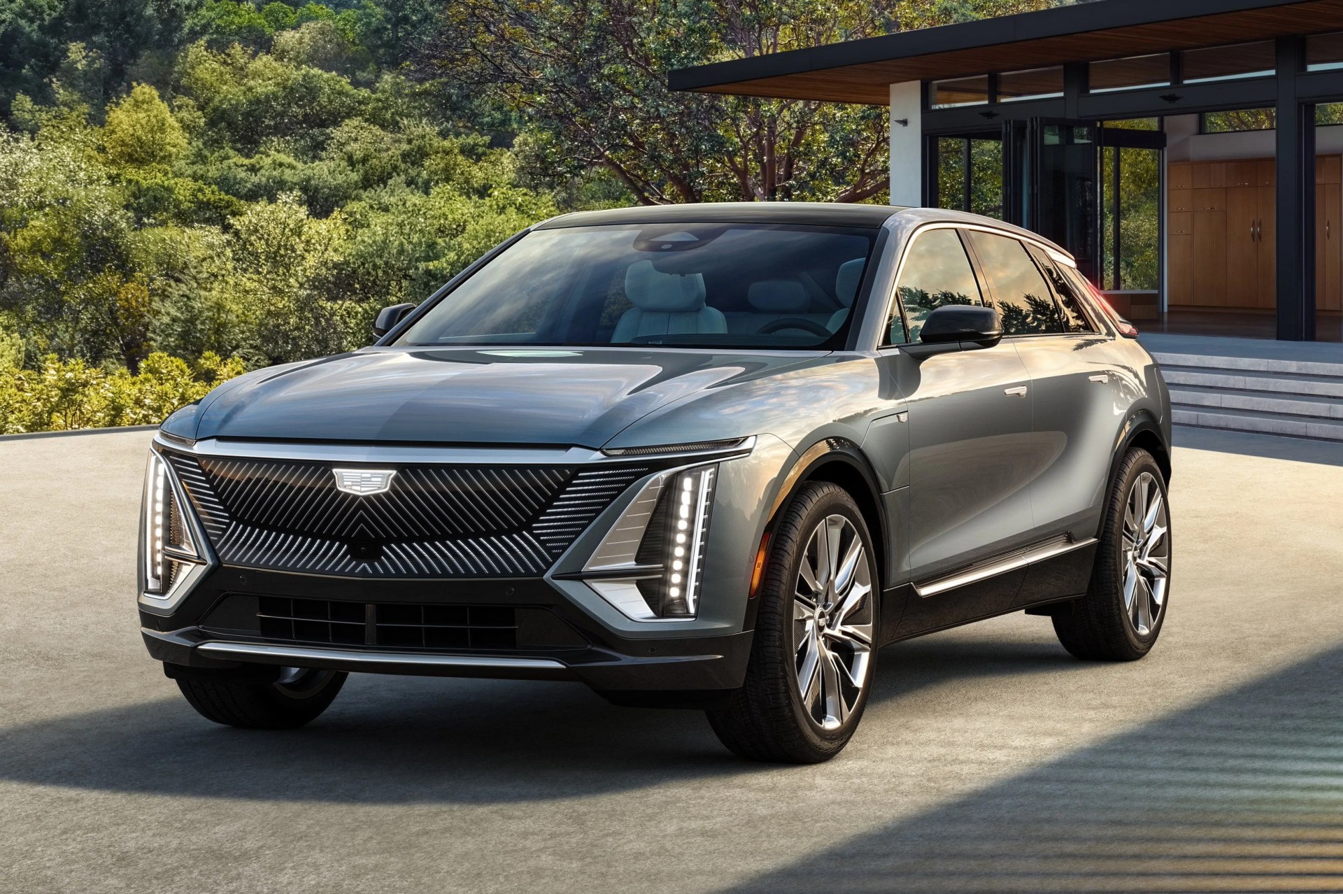 defined by taut lines and clean surfaces, lyriq is assertive and modern, characterized with a low, fast roofline and wide stance that emphasize agility and convey confidence additional details, such as a flow through roof spoiler, express the careful attention paid to aerodynamics to optimize efficiency on the highway