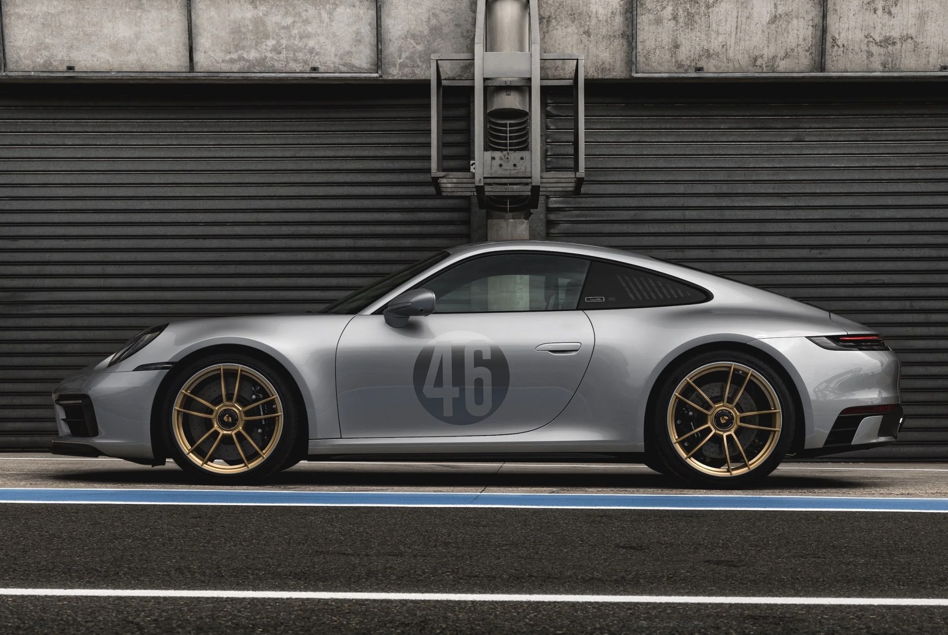 porsche 911 silhouette in front of a garage