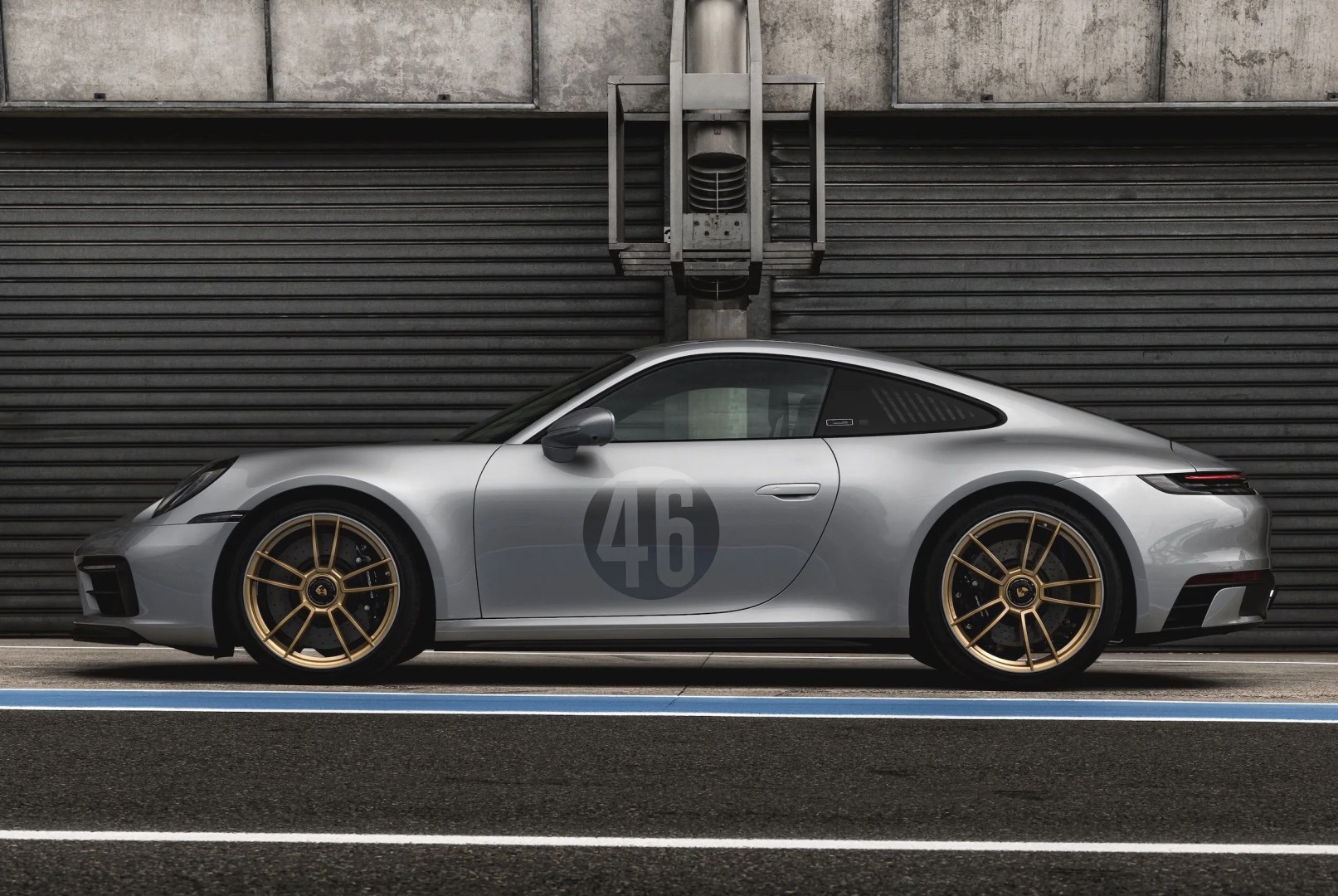porsche 911 silhouette in front of a garage
