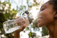 a woman with bottle of water