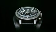 black chronograph watch on a bund leather strap