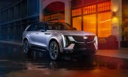 escalade iq in front of a building with red lighting