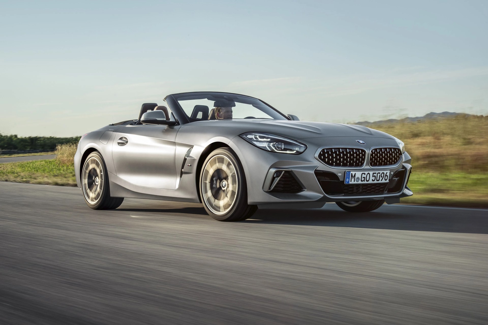 bmw z4 driving on a rural road