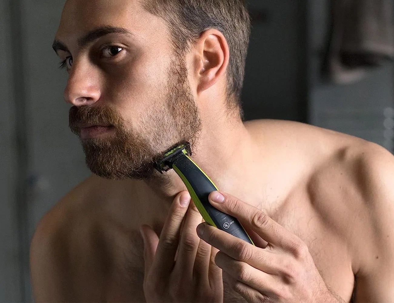 a man shaving with the philips norelco oneblade