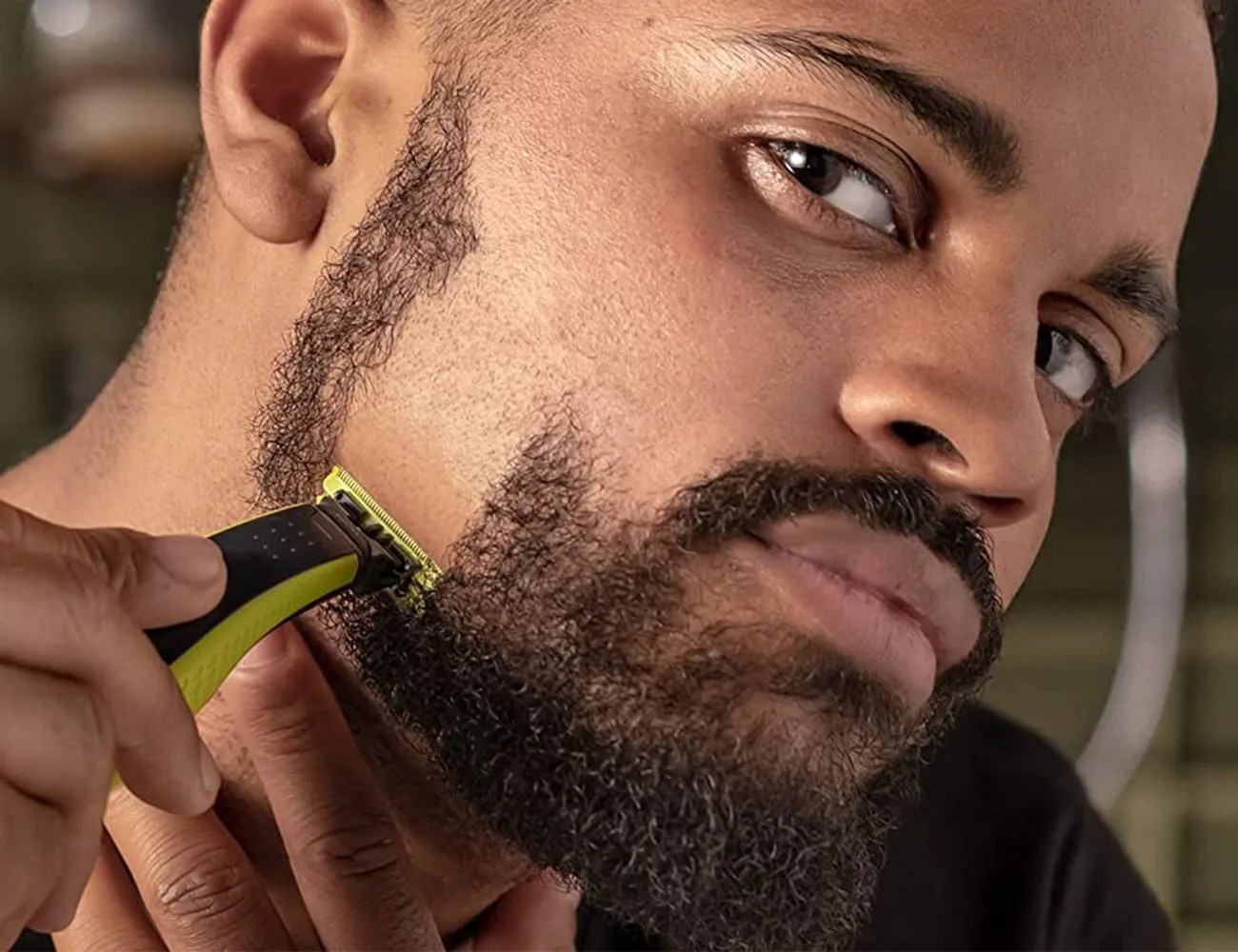 a man shaving with the philips norelco oneblade
