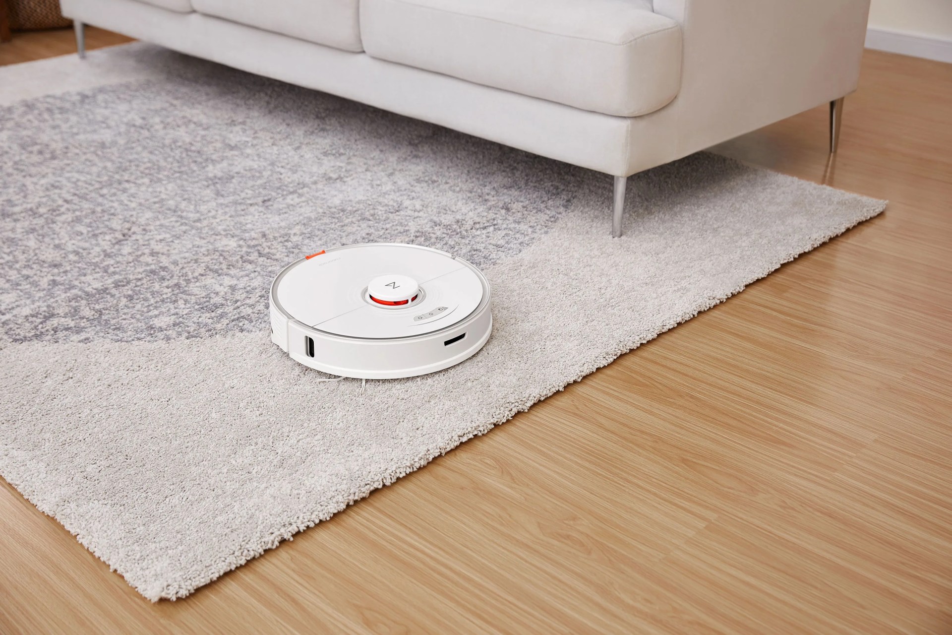 roborock s7 white vacuum going over carpet