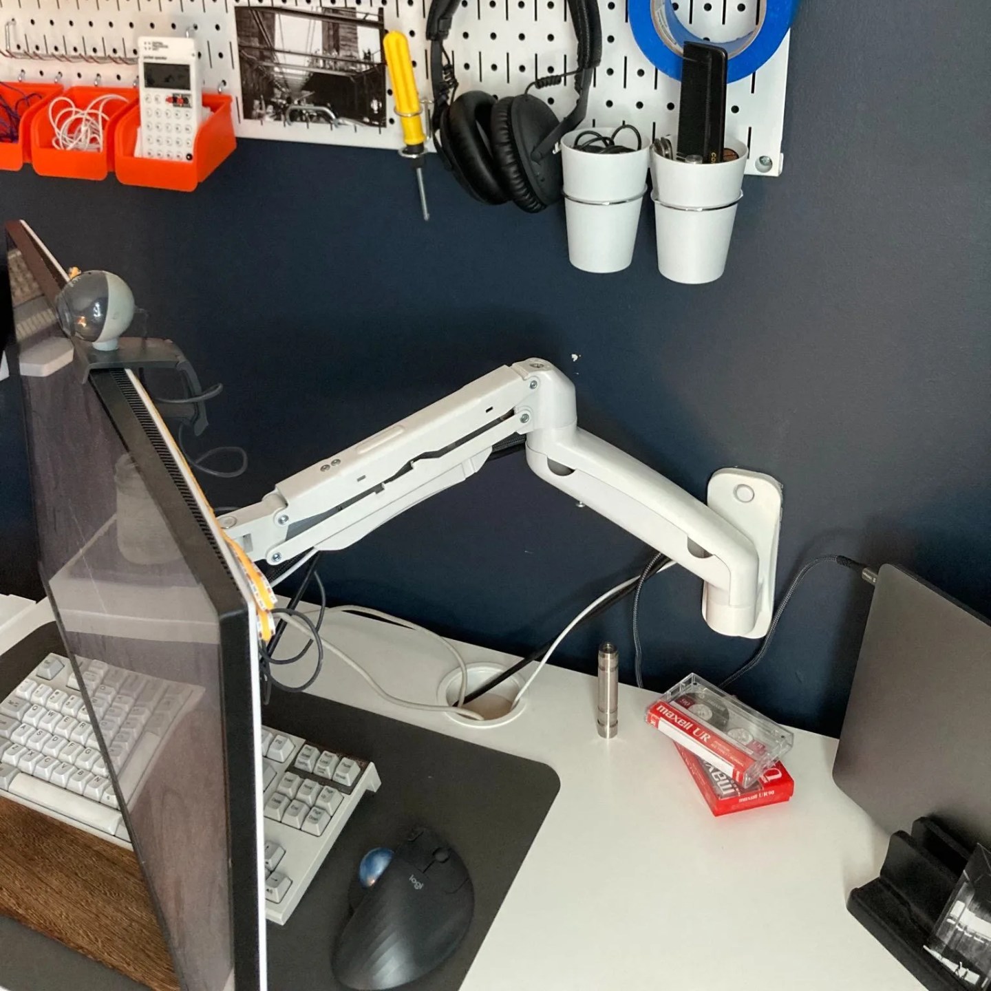 monitor attached to wall by arm
