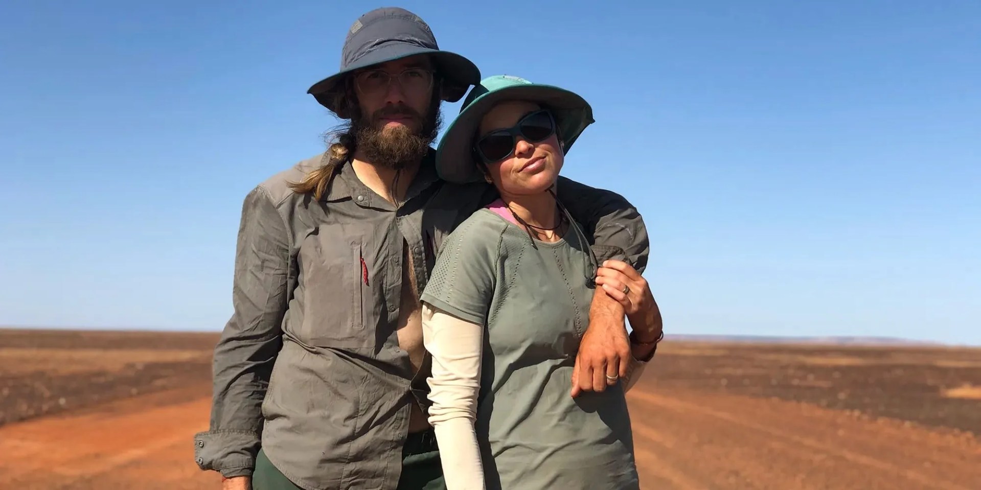 couple in layered clothing for the sun
