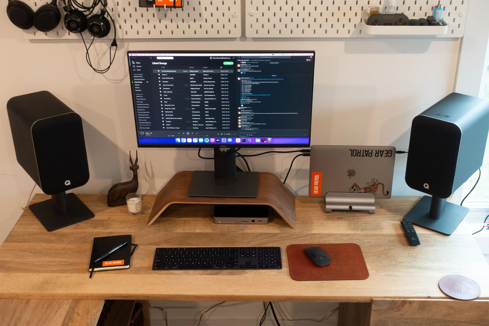 a monitor and speakers on a desk