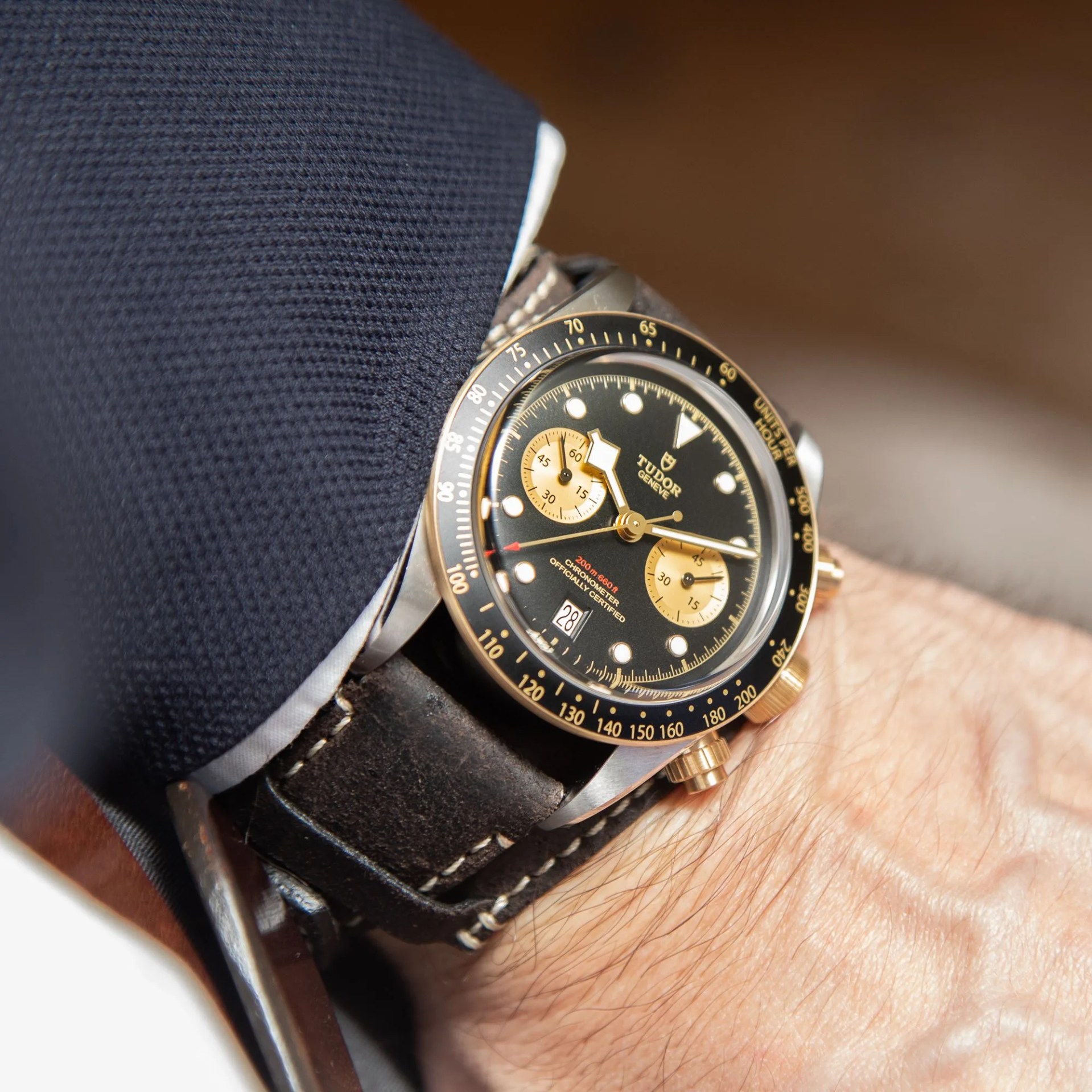 black and gold watch on a wrist