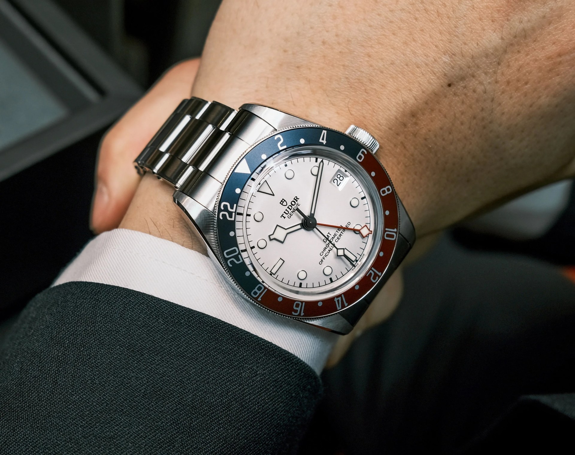 white dial watch on wrist