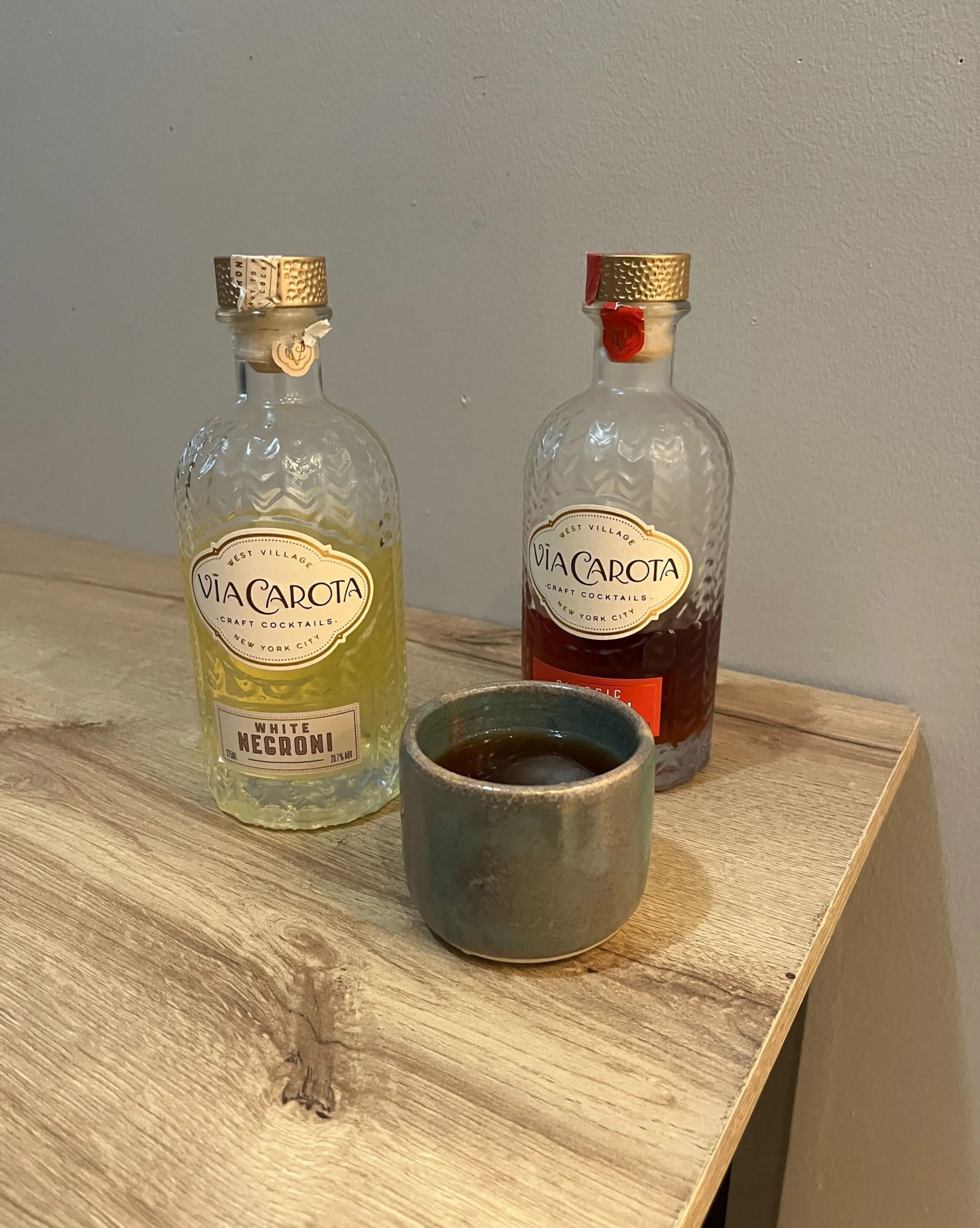 two bottles of pre mixed negroni cocktails