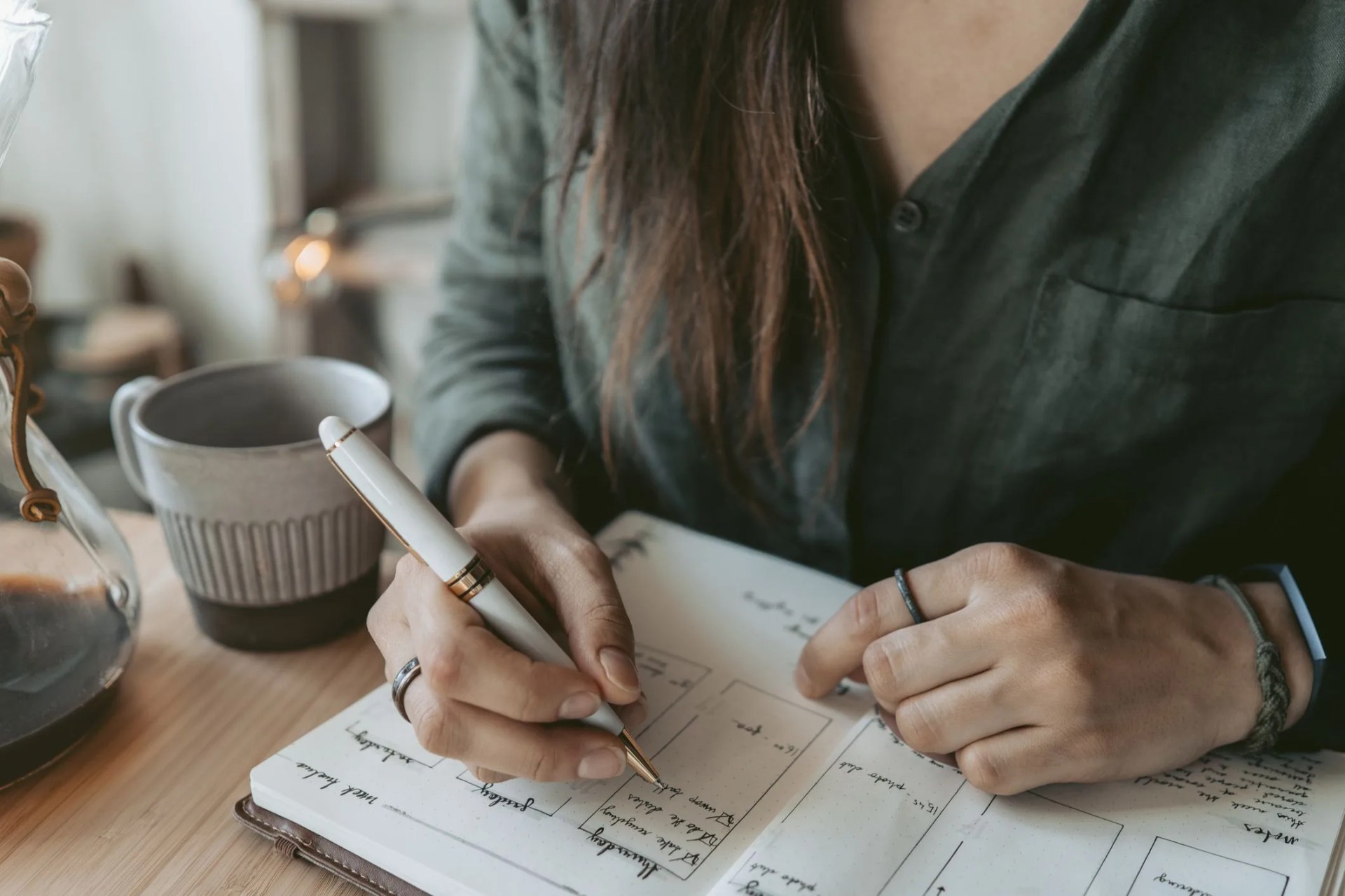 woman taking notes in her diary