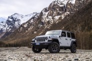 wrangler rubicon 4xe parked in front of mountains