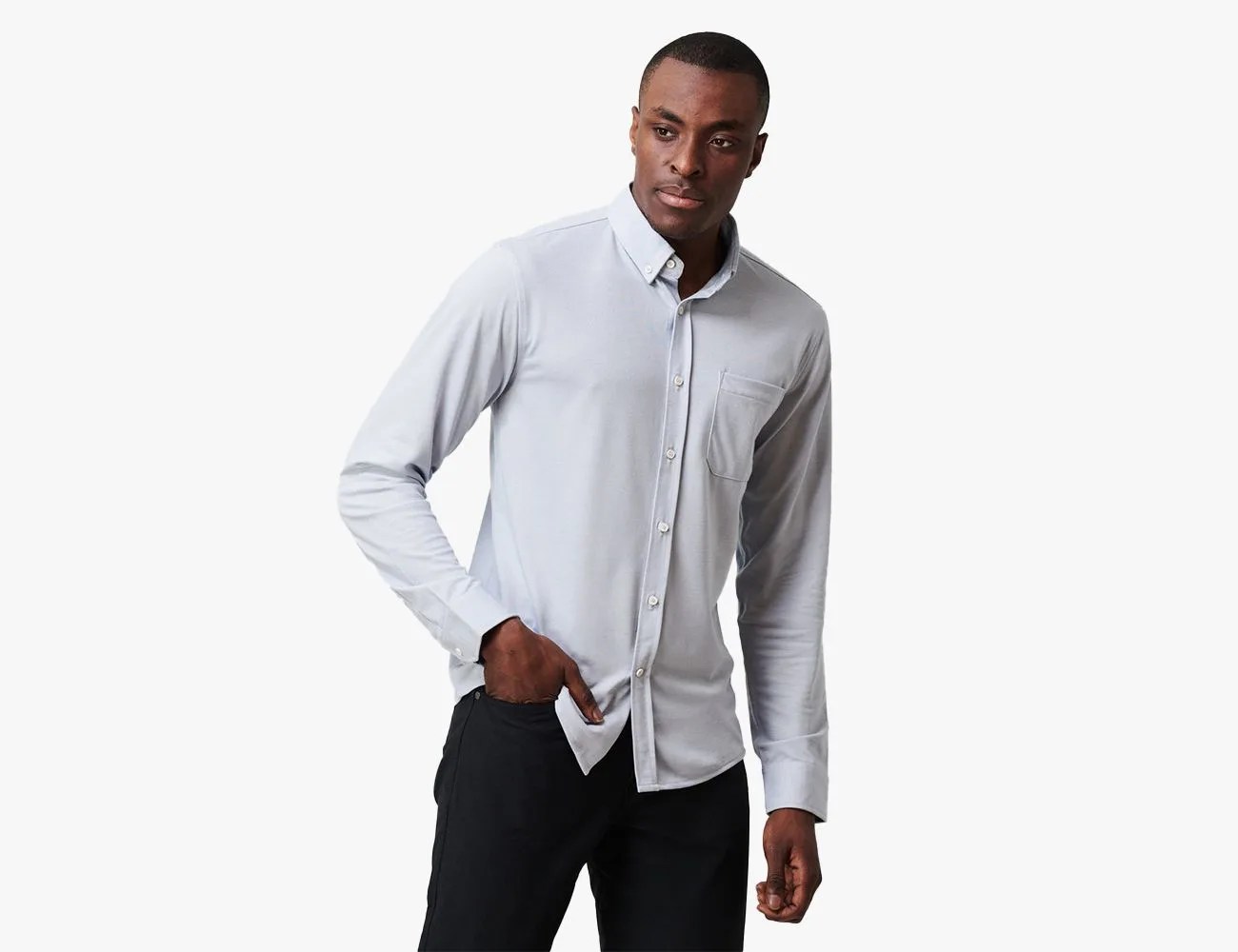 a man wearing a white button down shirt
