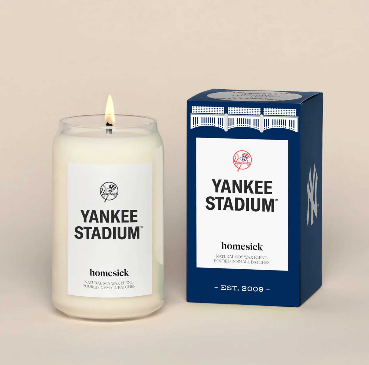 A photo of a candle and its packaging with New York Yankees branding