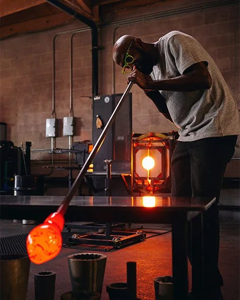 Cedric Mitchell blowing glass