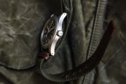 the hamilton khaki field mechanical watch laying on its side