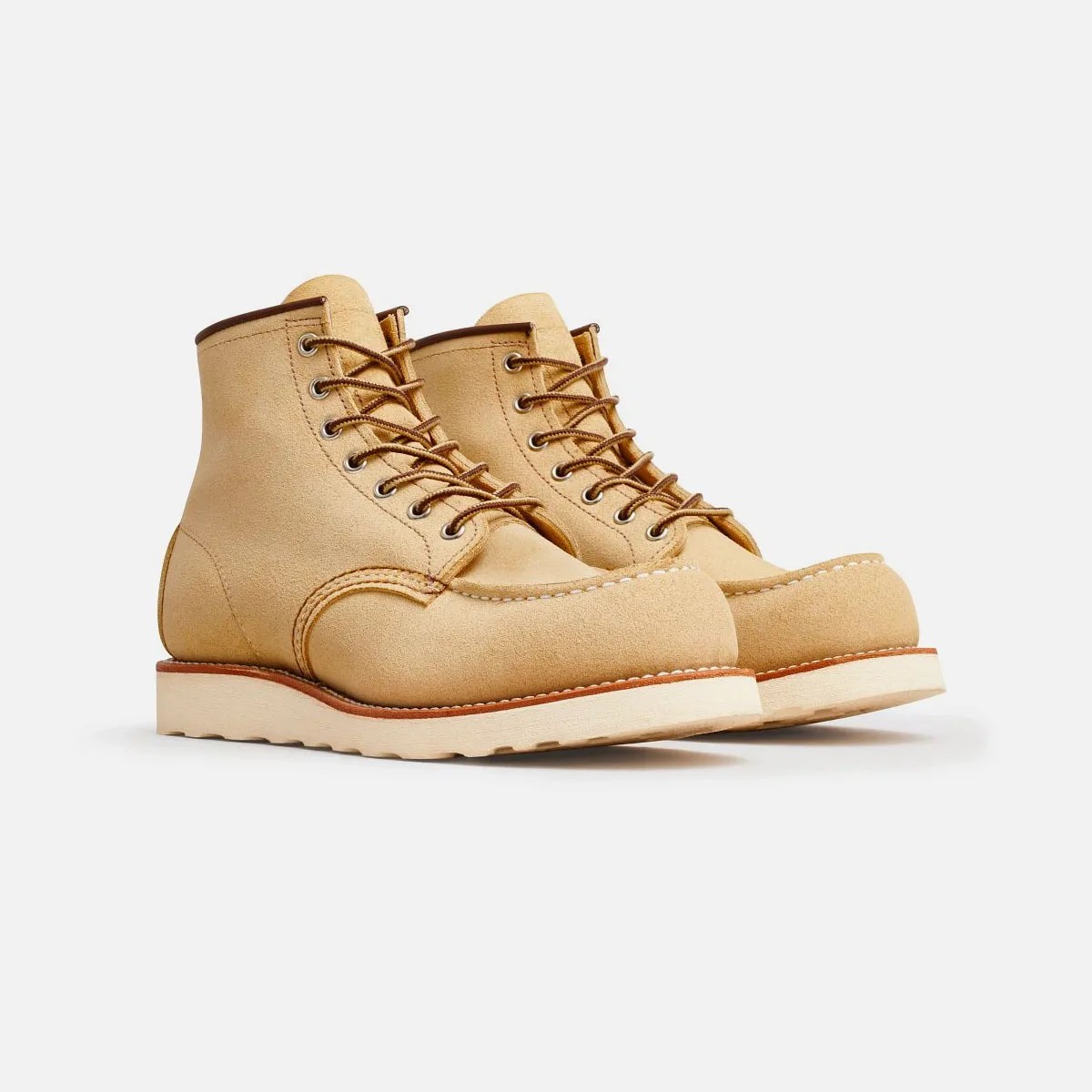 A pair of Red Wing Abilene Classic Moc Boots sitting diagonally on a grey background