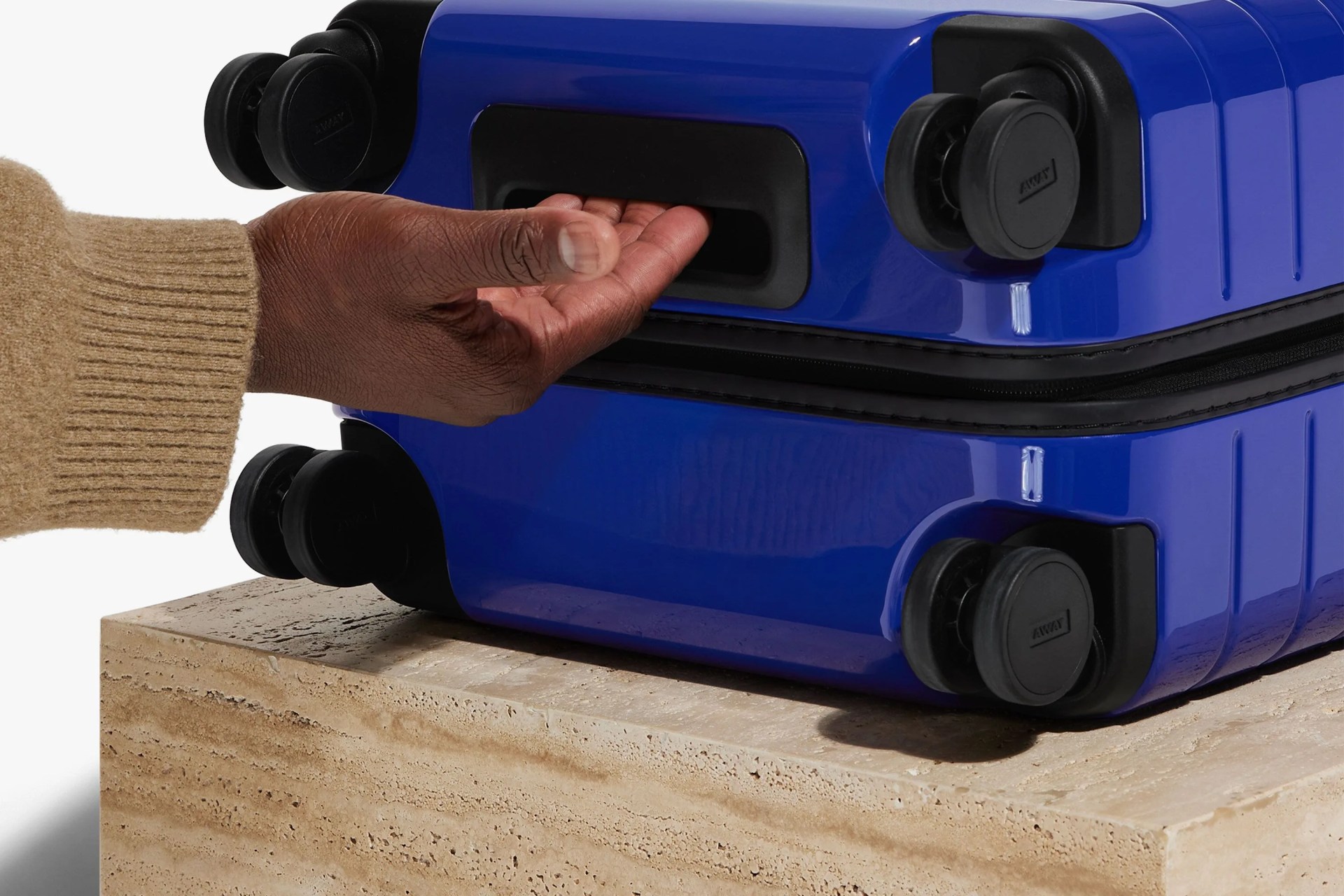opening the away suitcase in blue