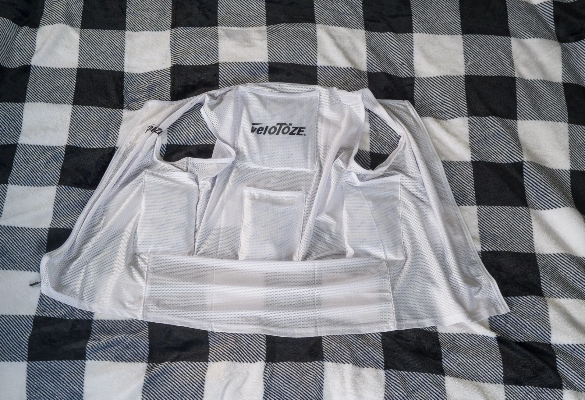 a cooling vest laying on a blanket