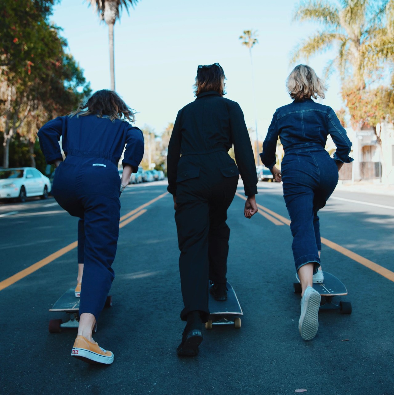 three girls skateboarding