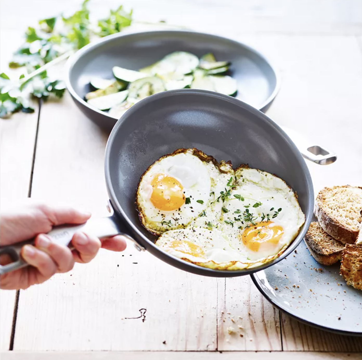 a frying pan cooking eggs