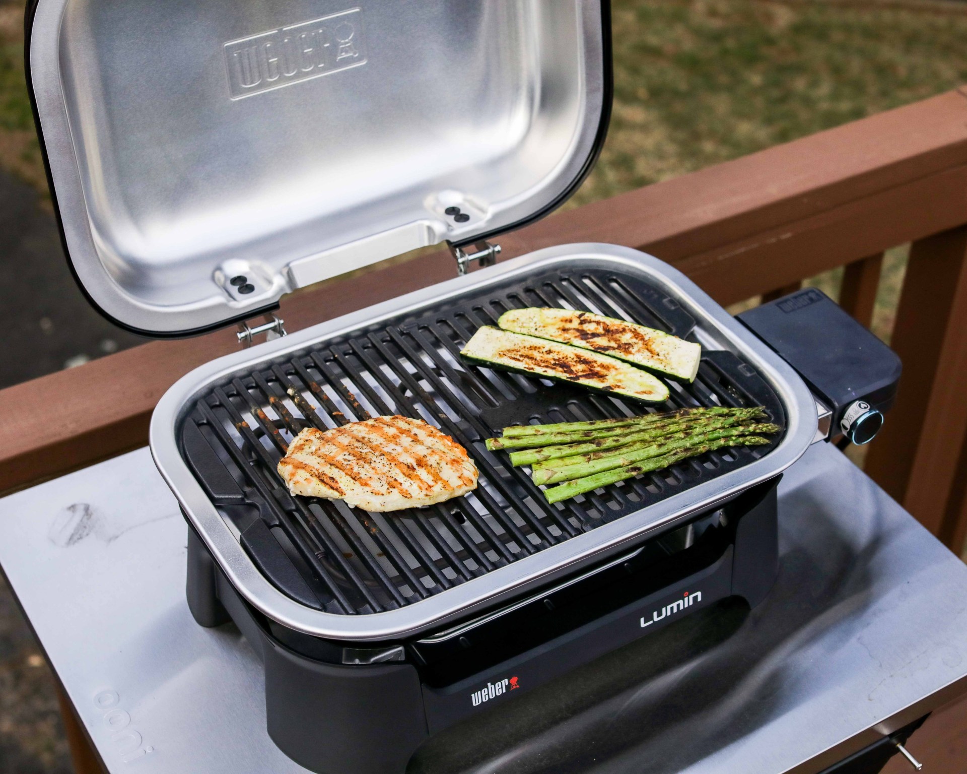 chicken and veggies on a grill top