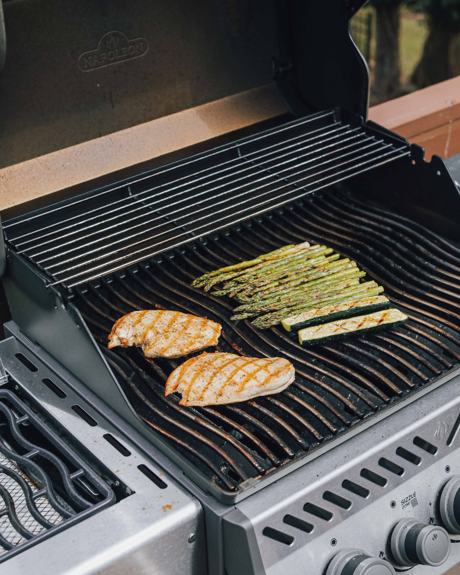 chicken and asparagus on a grill top