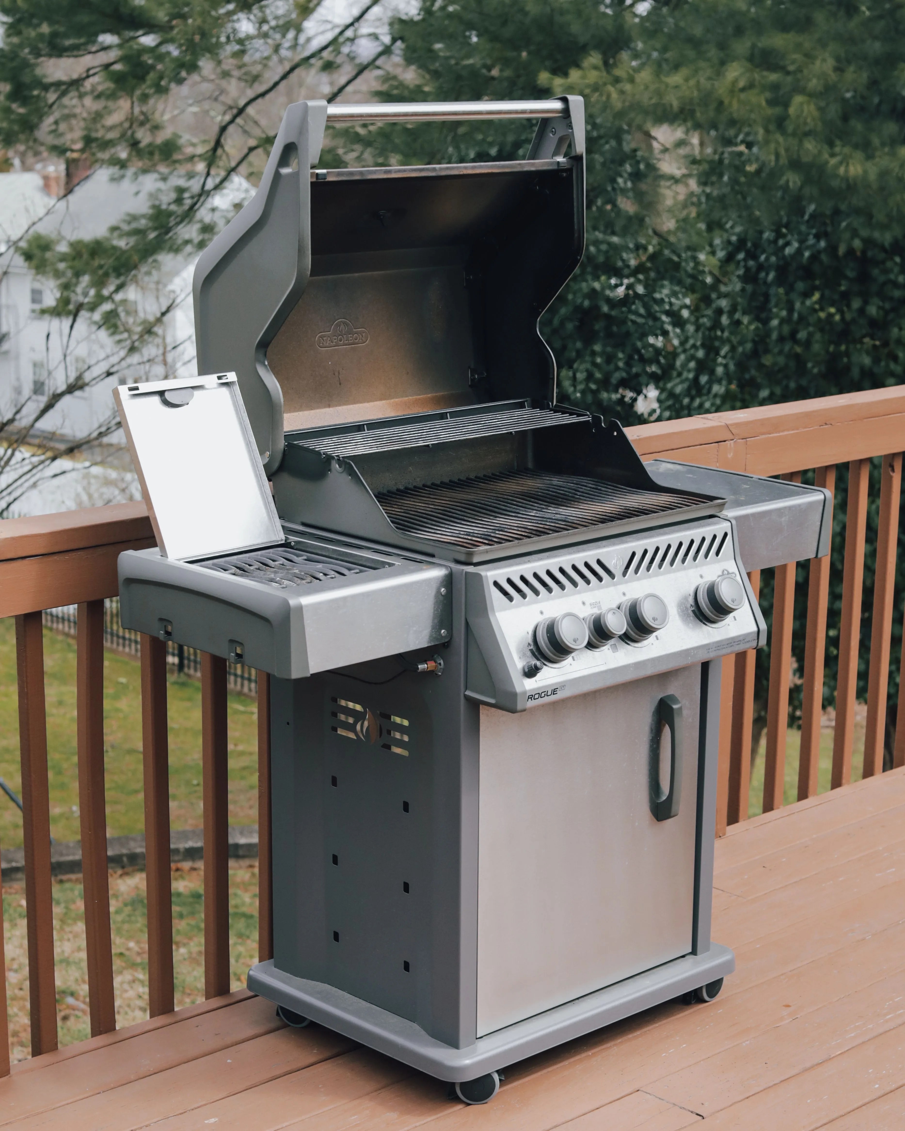 napoleon rogue xt gas grill on a deck