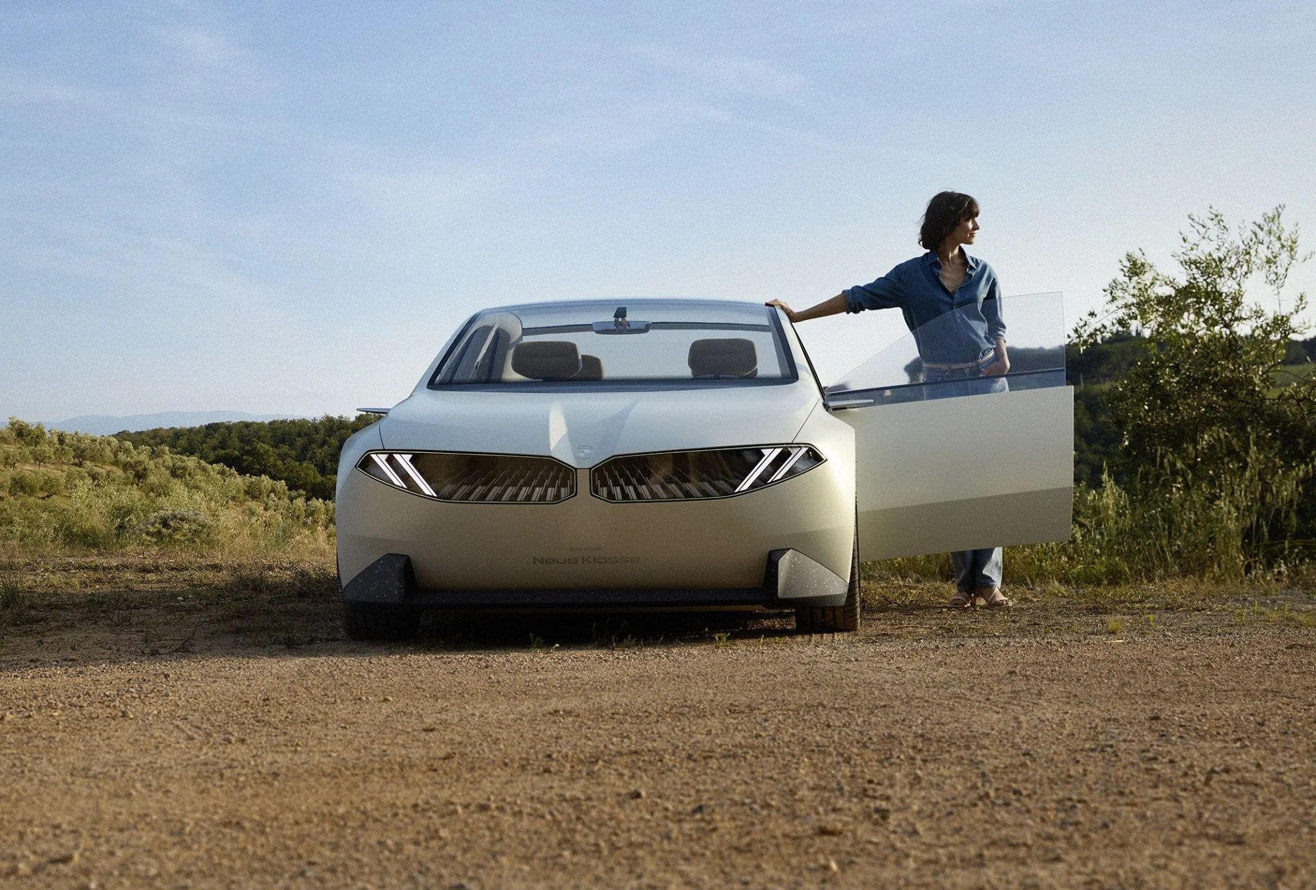 bmw neue klasse sedan concept with woman