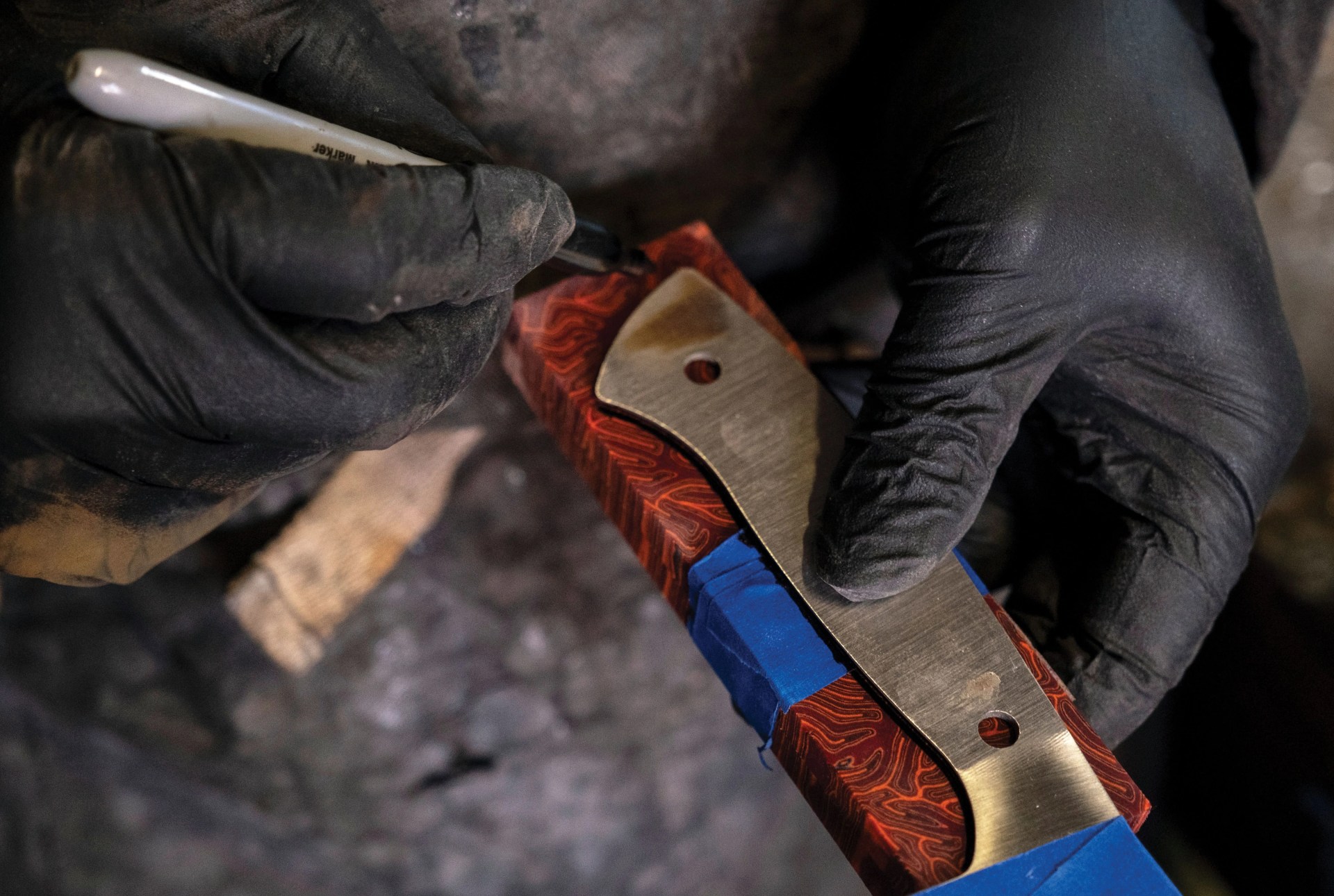 quintin middleton outlines the bottom of a carbon steel chef knife to craft into a handle