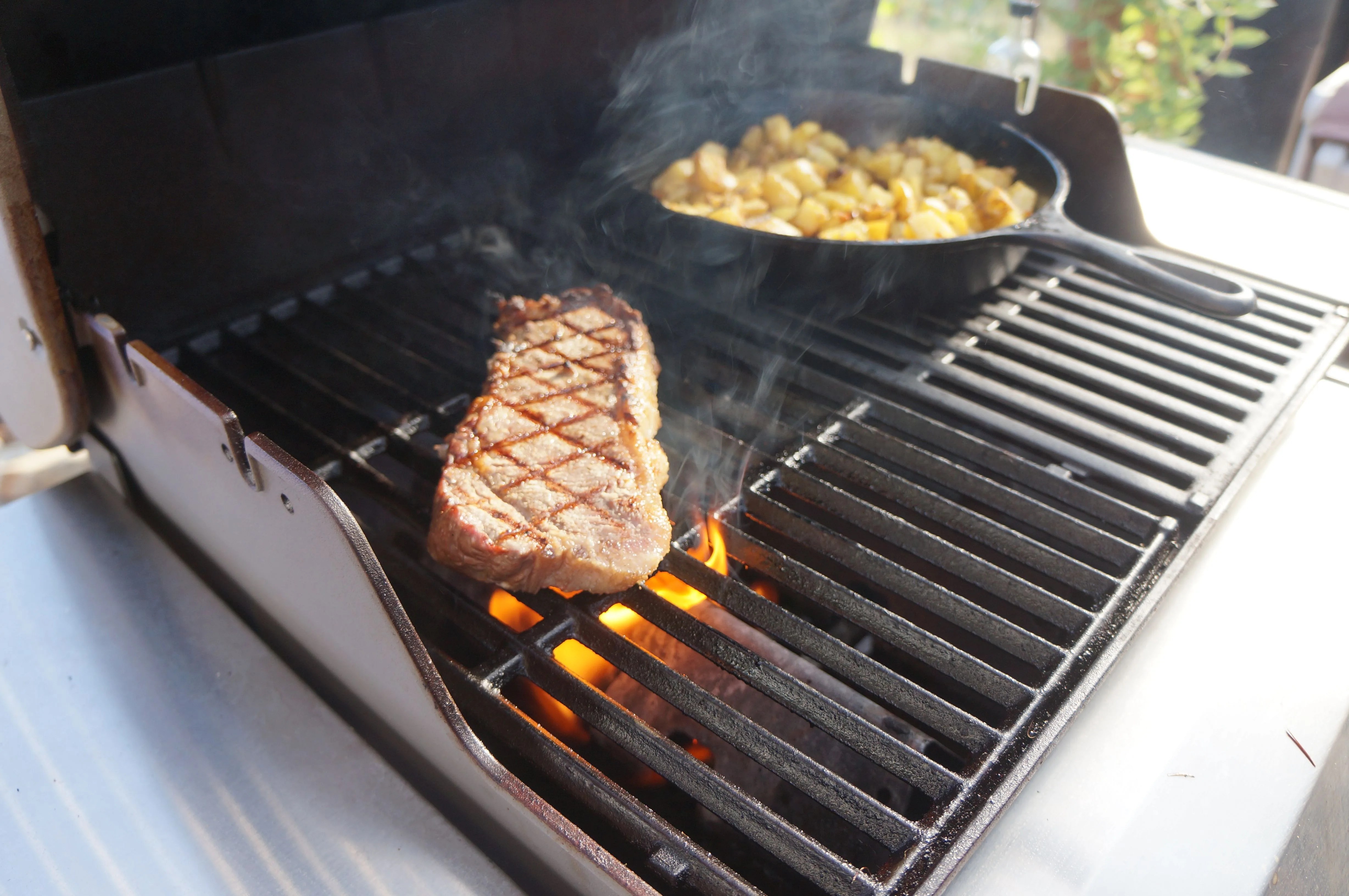 grilling a strip steak on the weber spirit