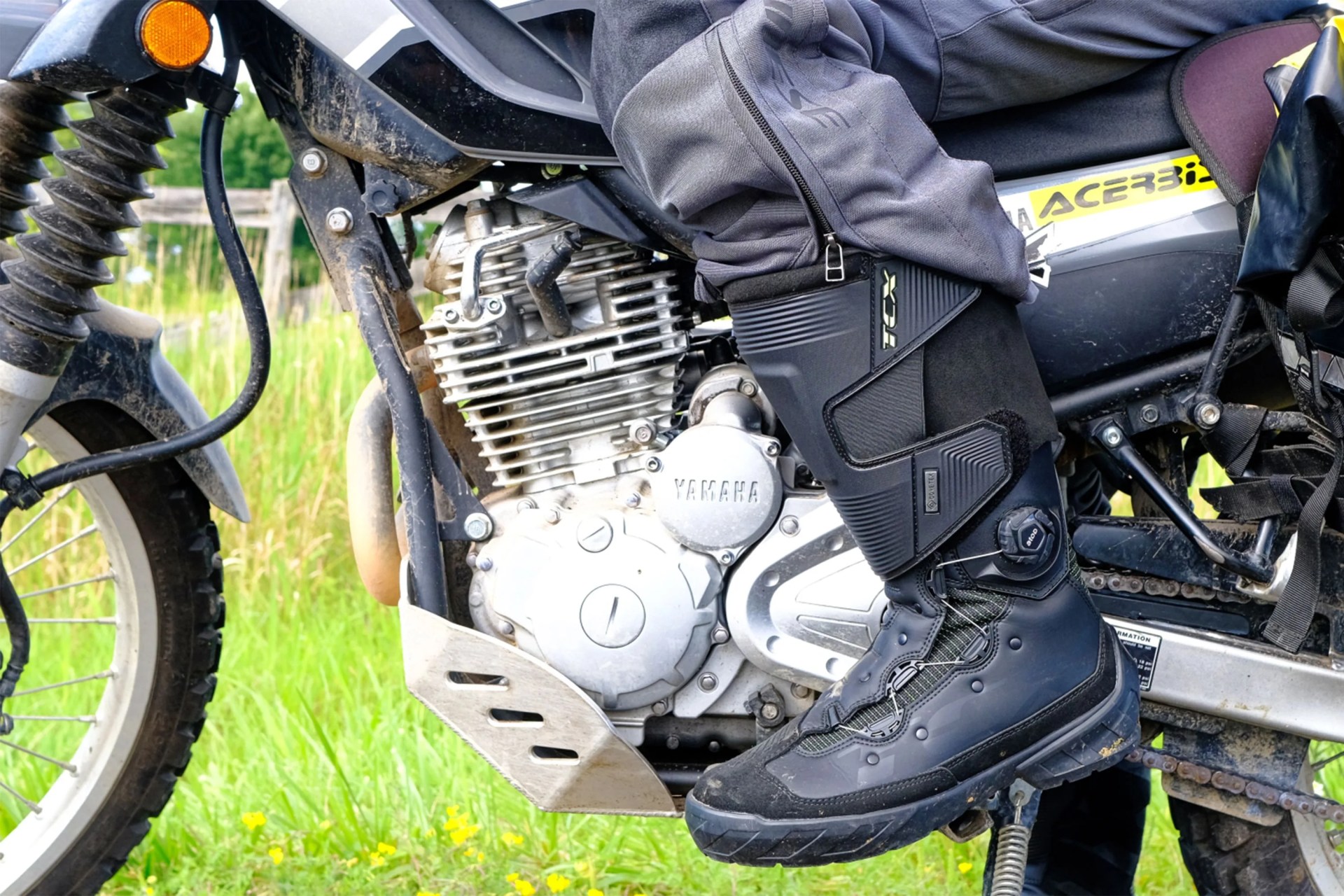 close up of a mans boot on a motorcycle